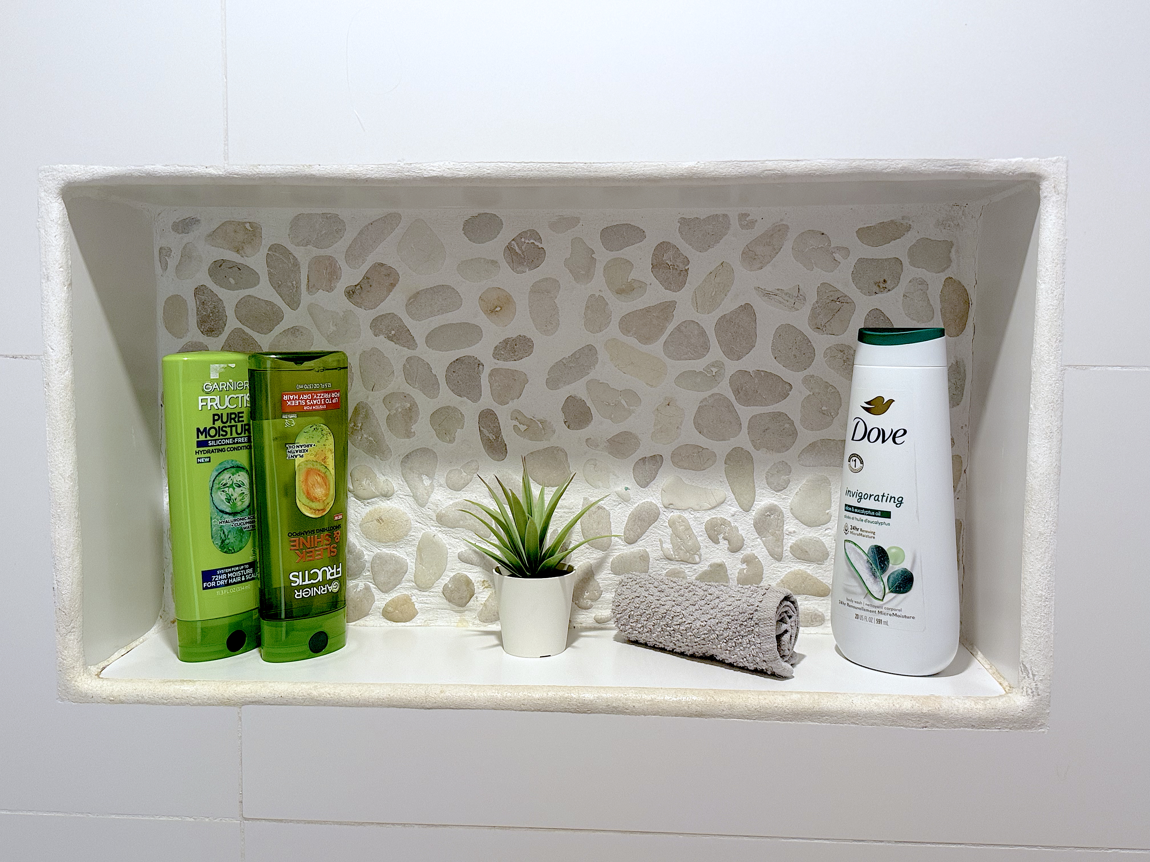 Modern bathroom with walk-in shower and complimentary toiletries